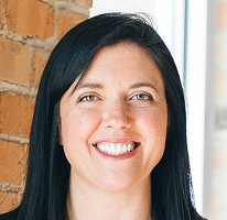 Customer support head Sophie Hartwell leading a service team, portrait